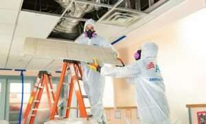 How do fire damage restoration companies handle water damage from firefighting in Plano?