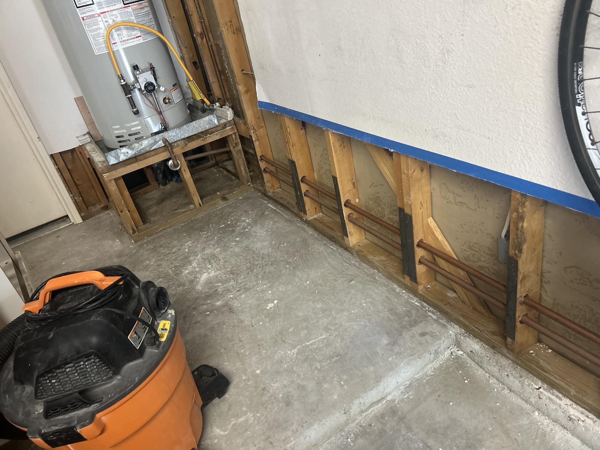 Garage water damage mitigation in progress