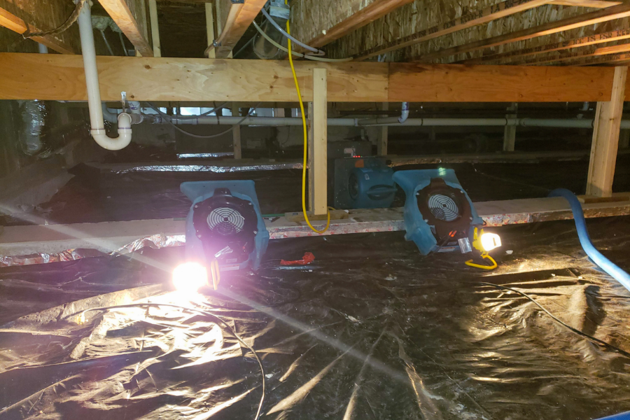 Professional crawl space water damage restoration equipment in action