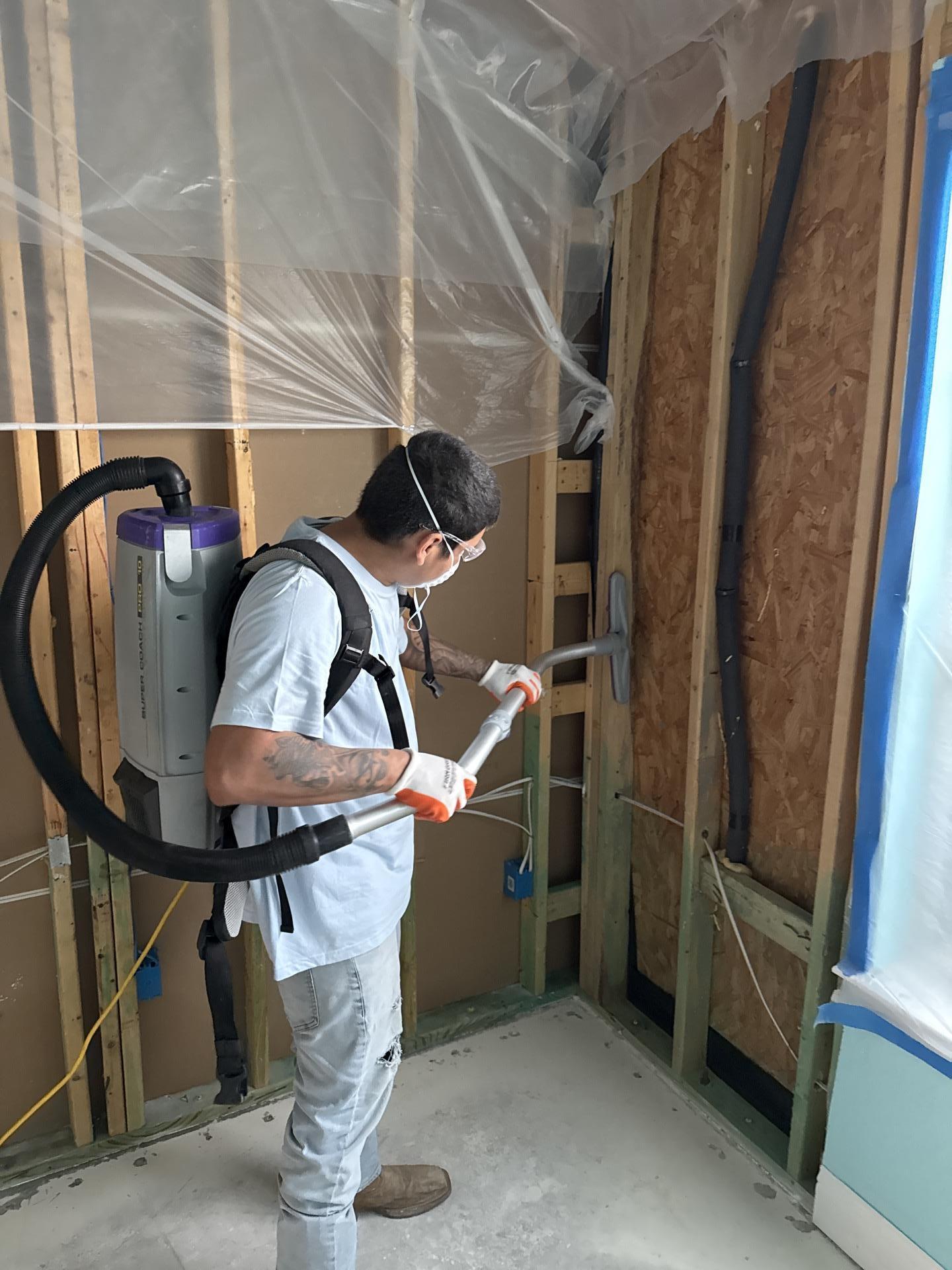 HEPA vacuum being used to clean affected areas