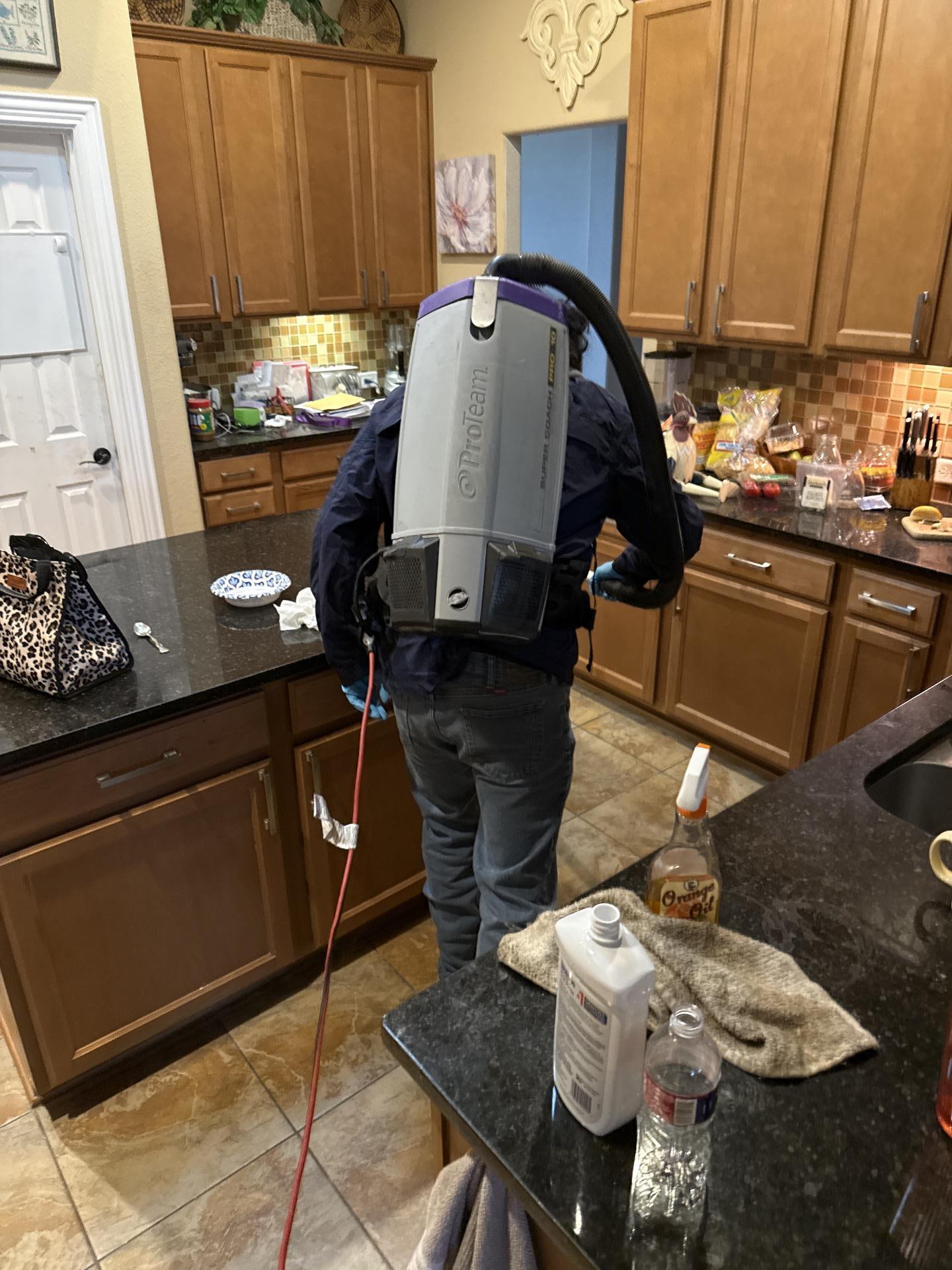 Kitchen being HEPA vacuumed during restoration