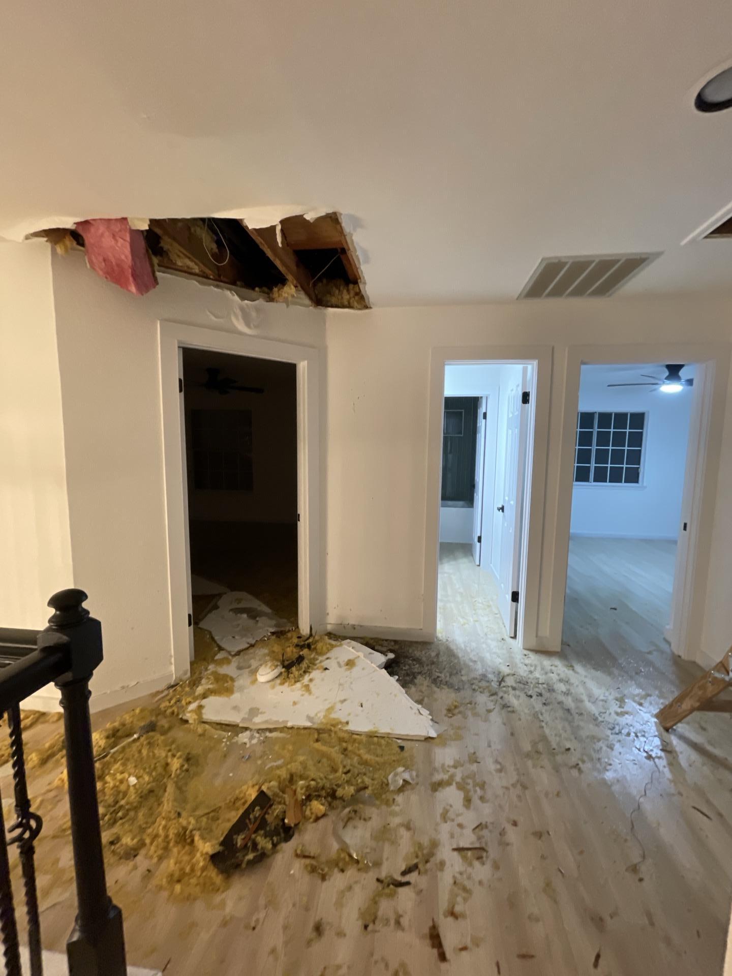 Collapsed ceiling in upstairs hallway