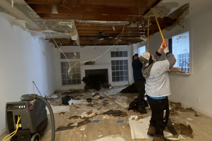Complete ceiling and drywall demolition showing the scope of reconstruction work needed