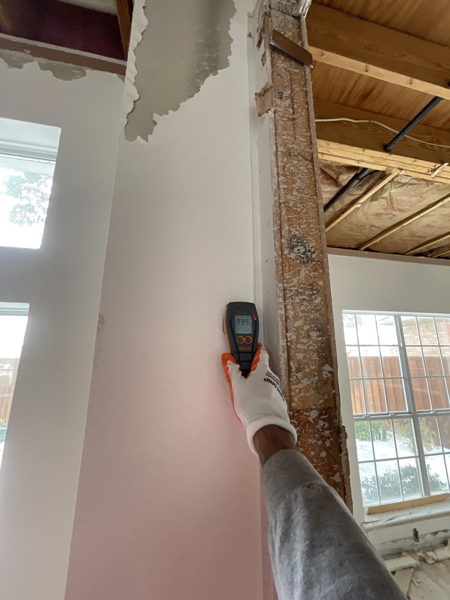 Drywall moisture reading showing water damage