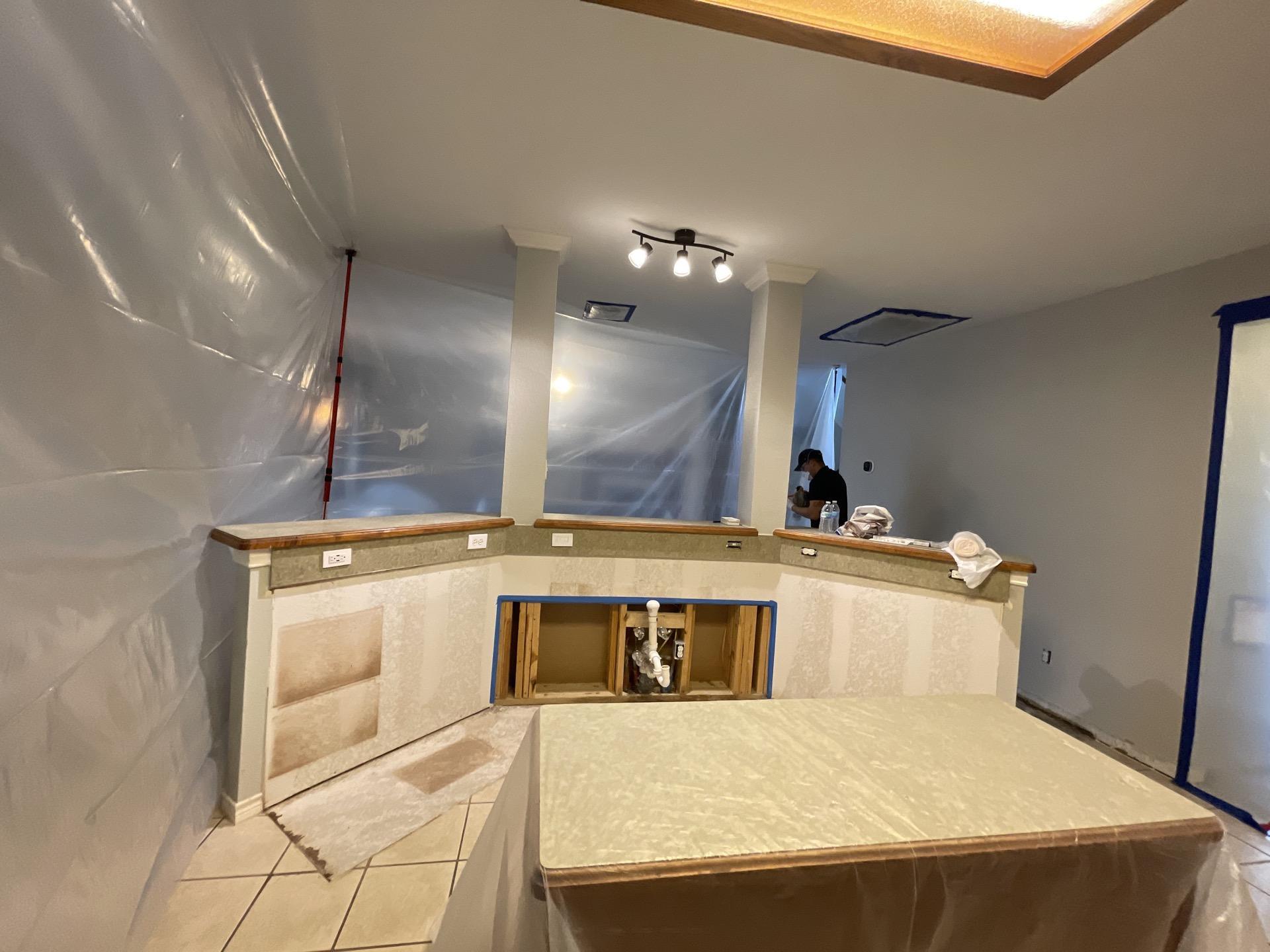 Kitchen after demolition and drying phase completed for dishwasher leak restoration
