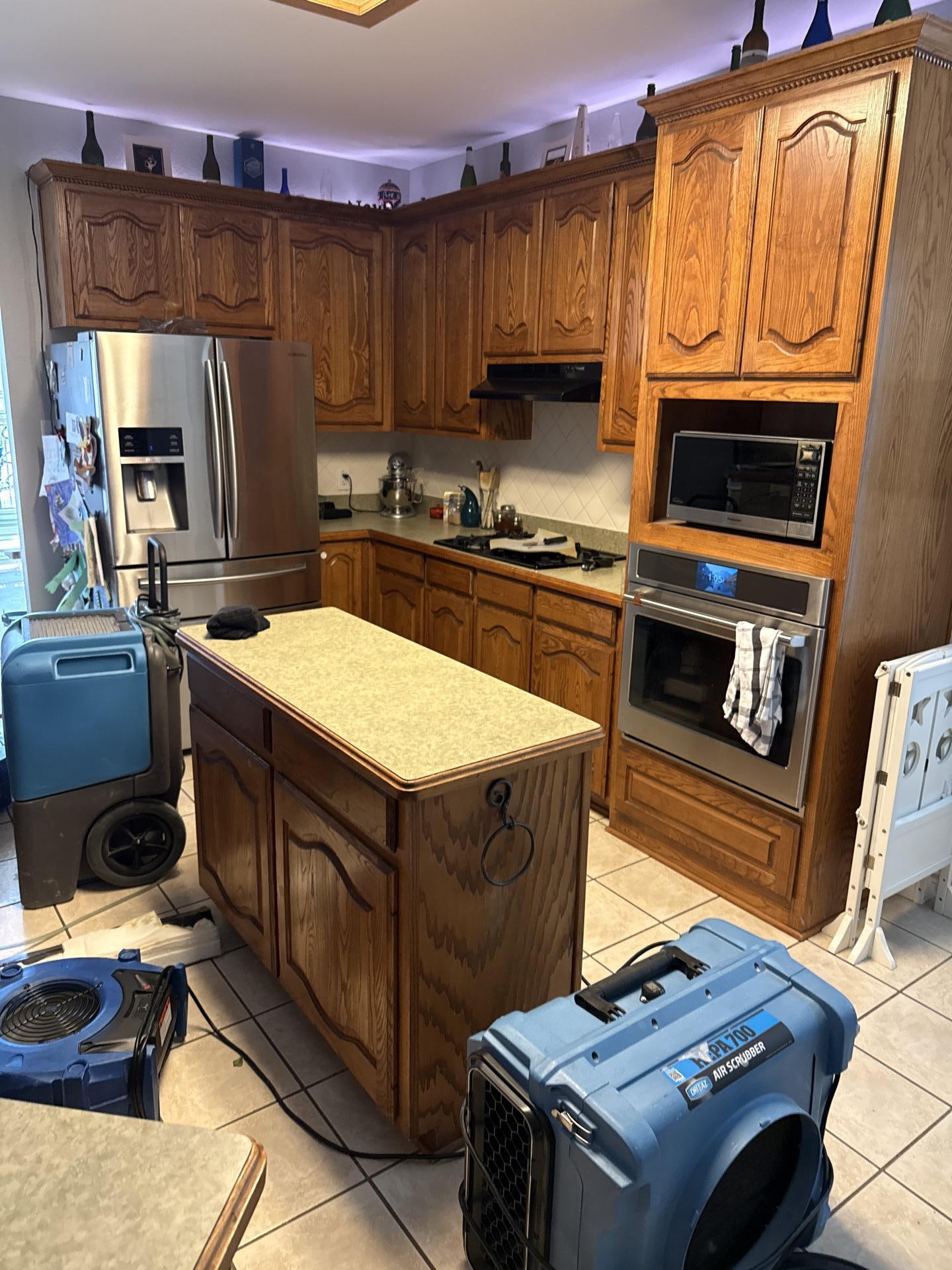 Final drying stage of dishwasher water damage restoration in Allen TX