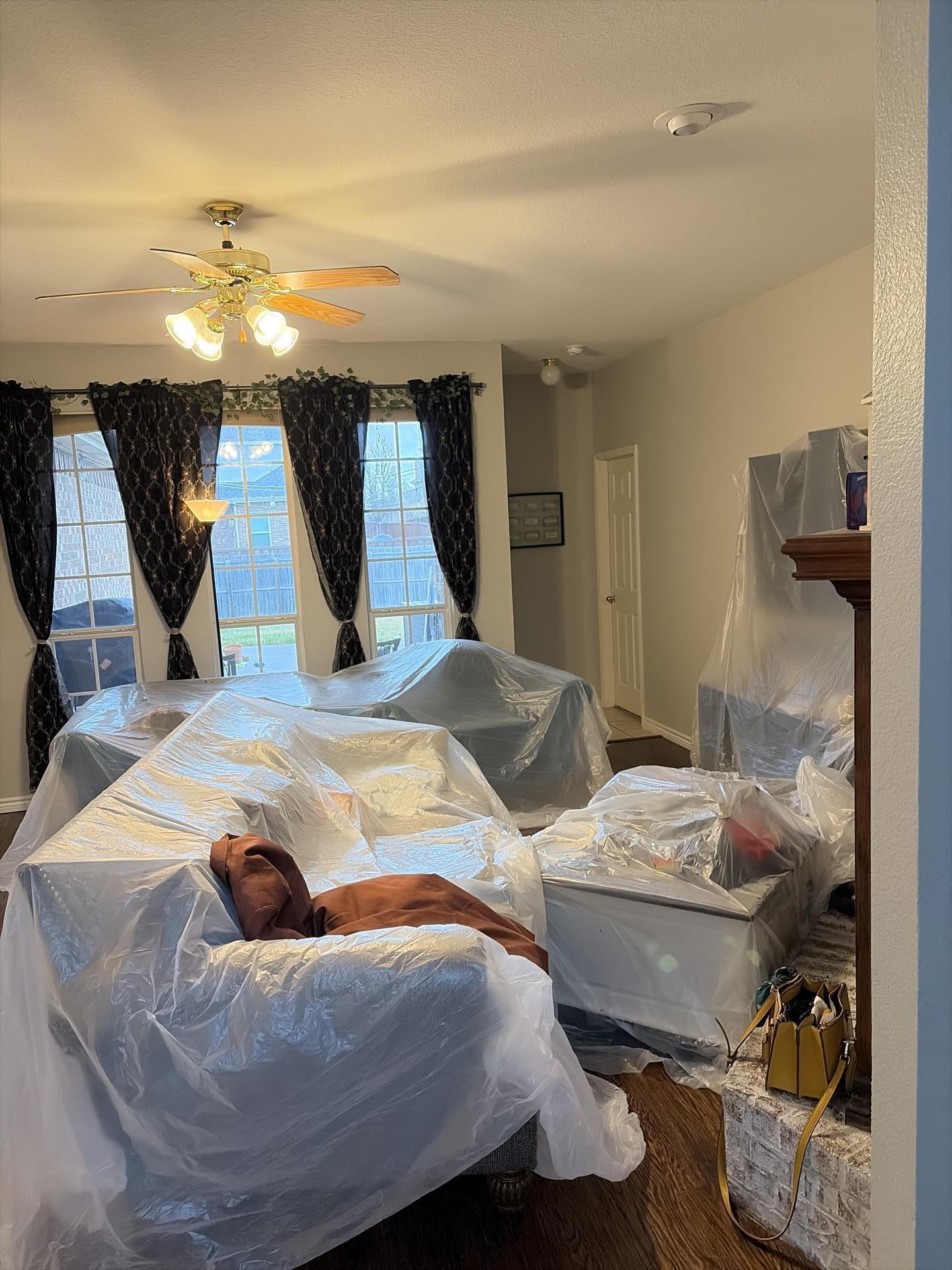 Second containment zone set up in living room during water damage restoration
