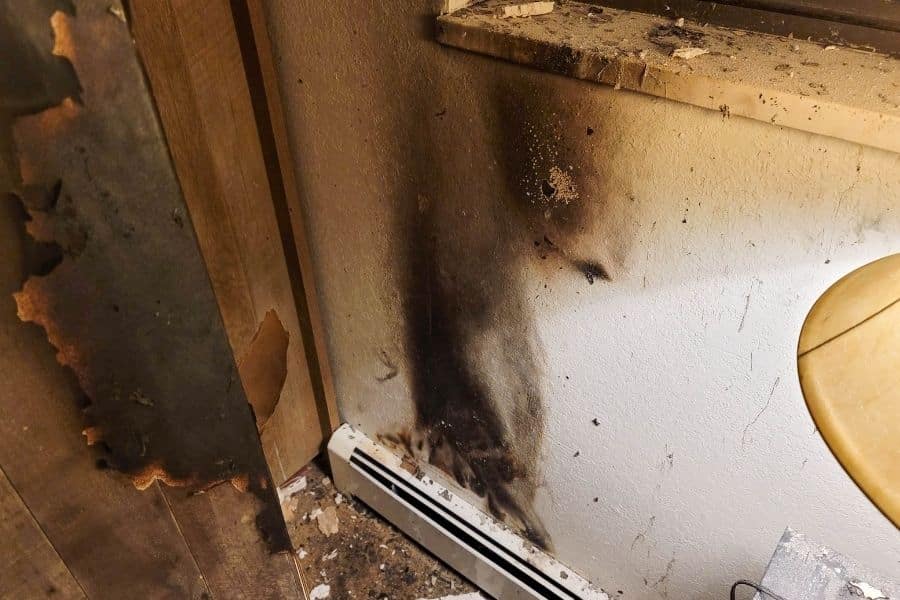 Soot residue visible on drywall surface requiring professional smoke damage cleanup