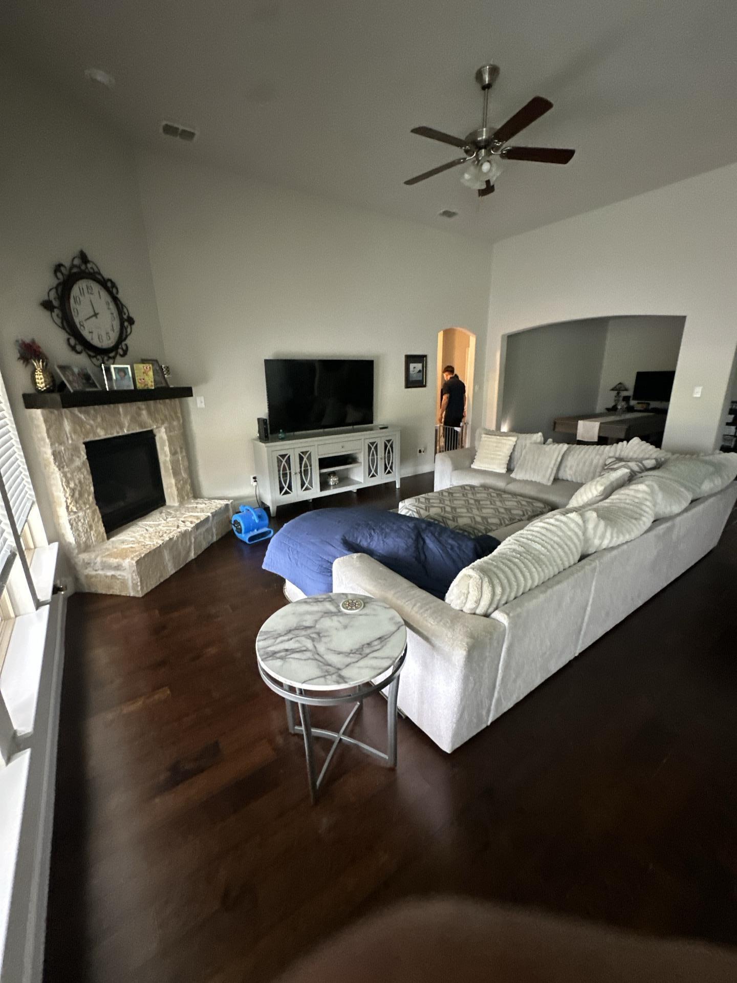 Living room water damage restoration with drying equipment in Melissa TX home