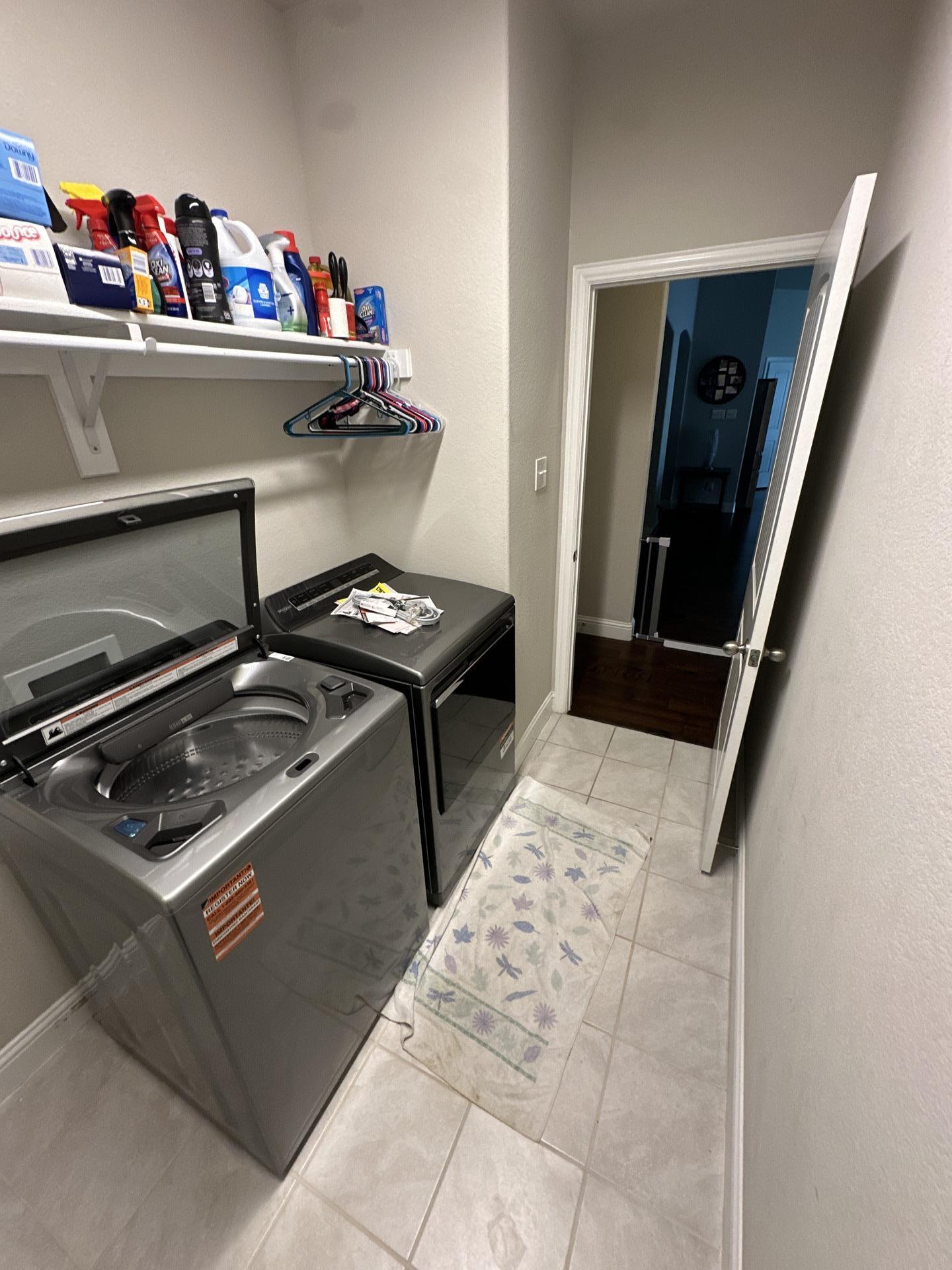 Washing machine leak causing water damage in a Melissa TX laundry room