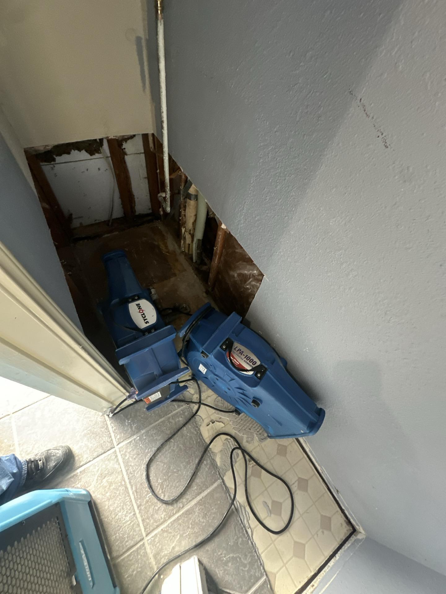 Drying process underway in the space where the water heater sat