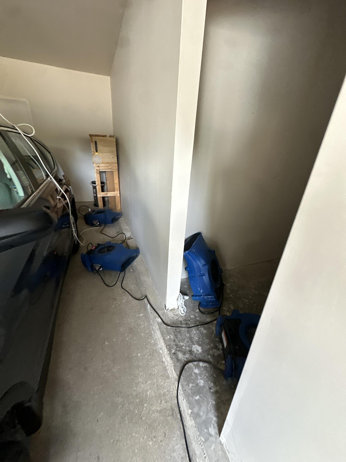 Garage area drying with low profile air movers after water damage