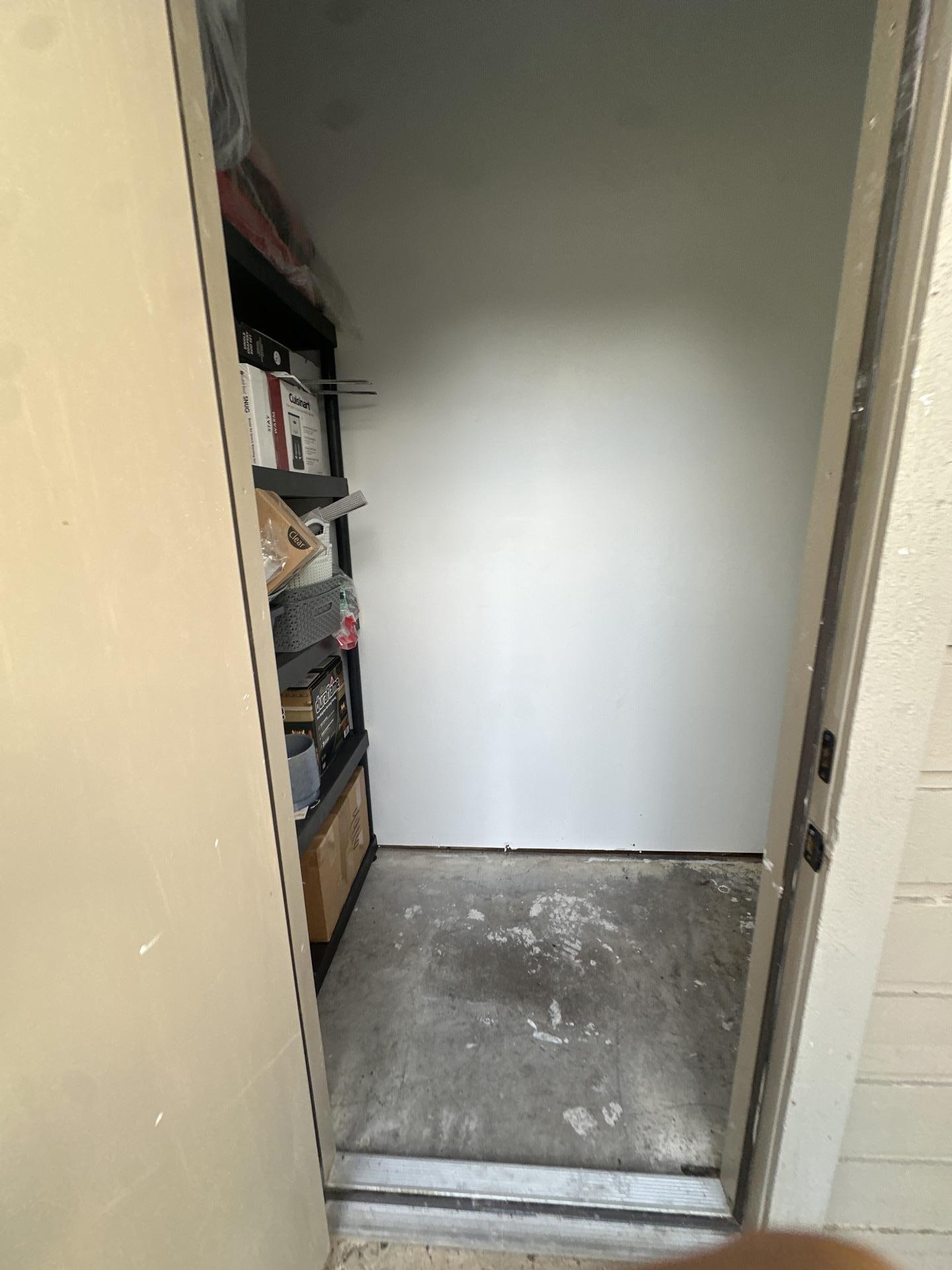 Water damaged outside storage closet in a Plano condo before restoration