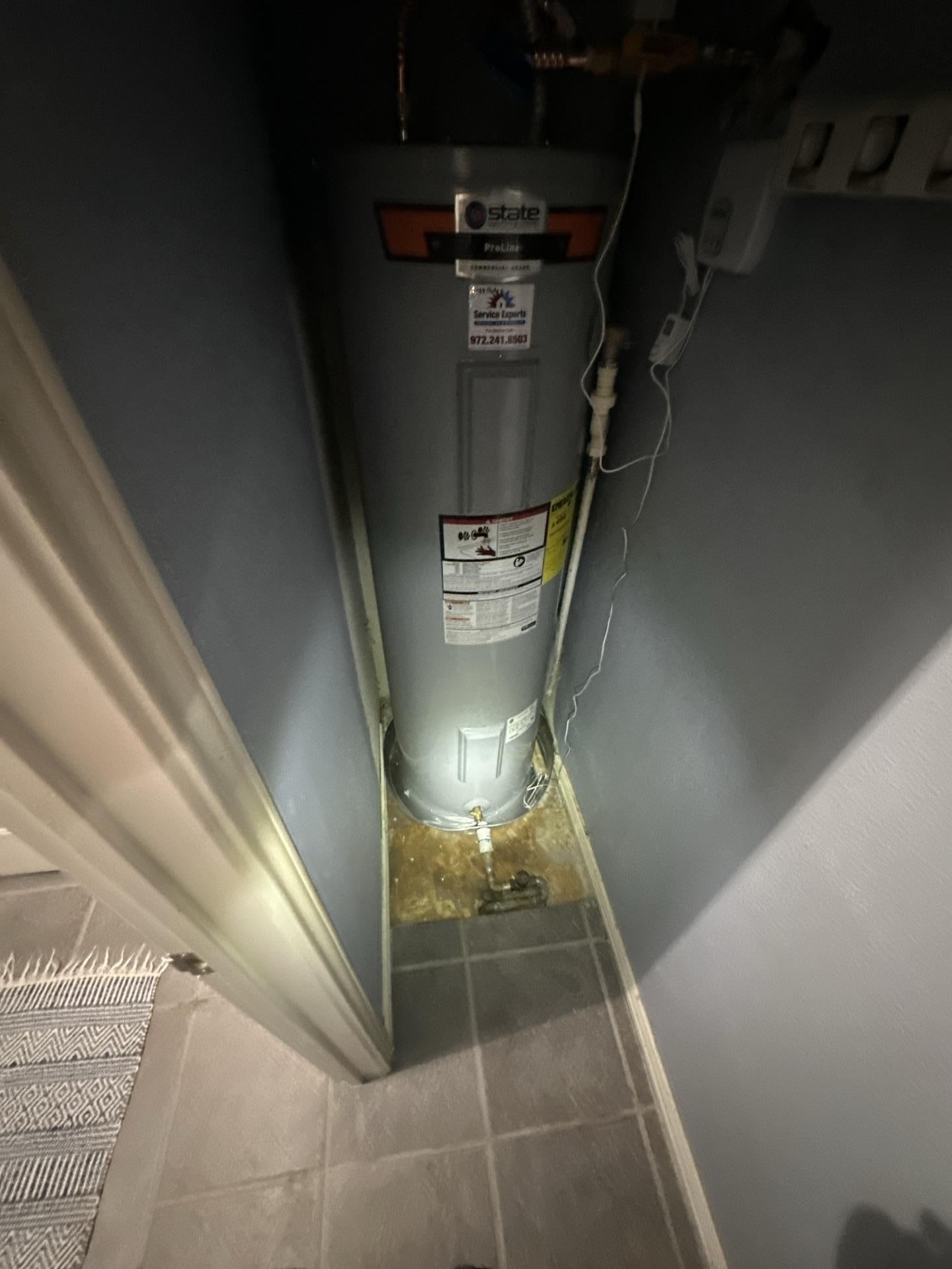Water heater water damage inside a condo storage room