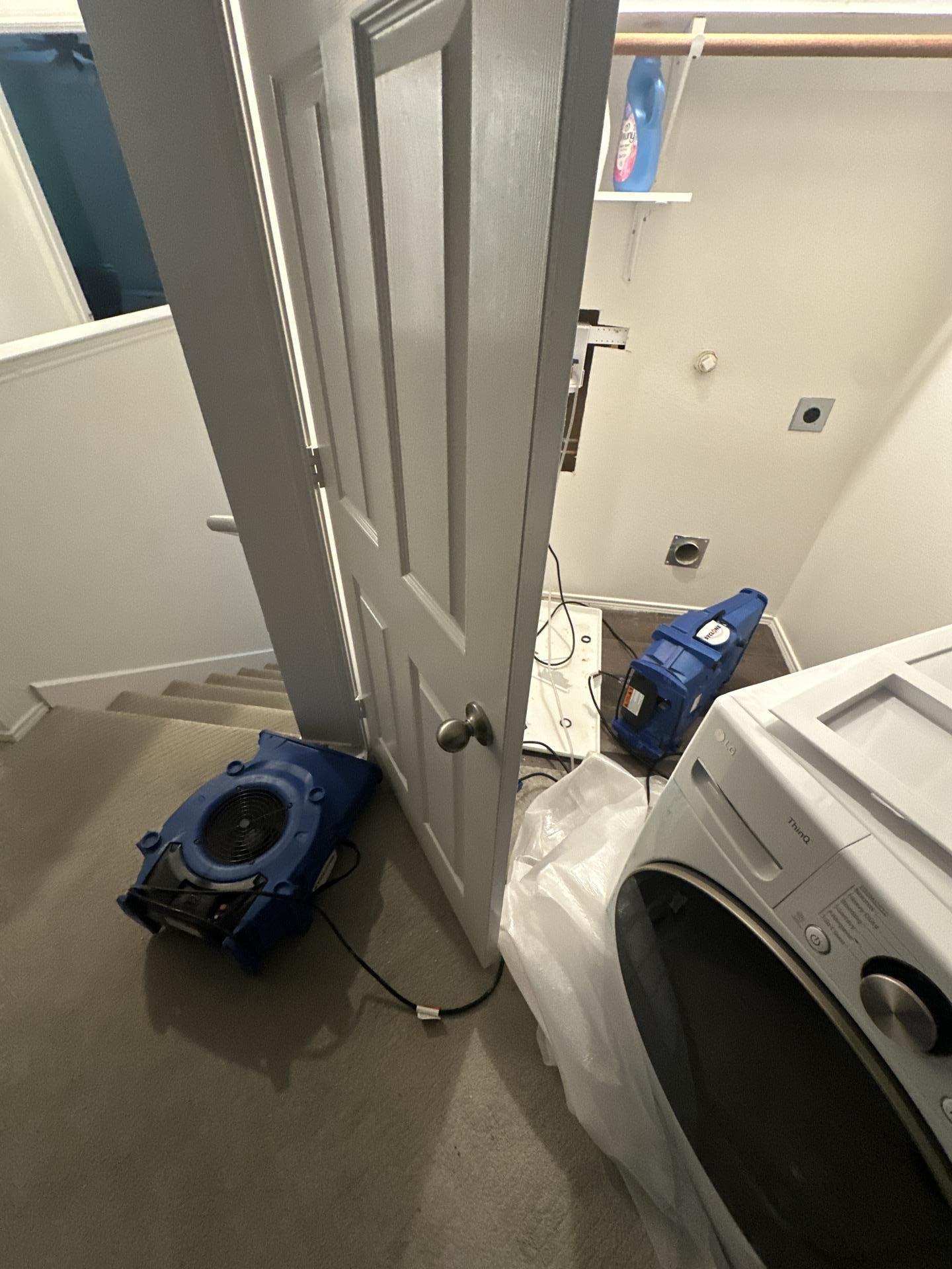 Air movers running during the drying process in the affected laundry room