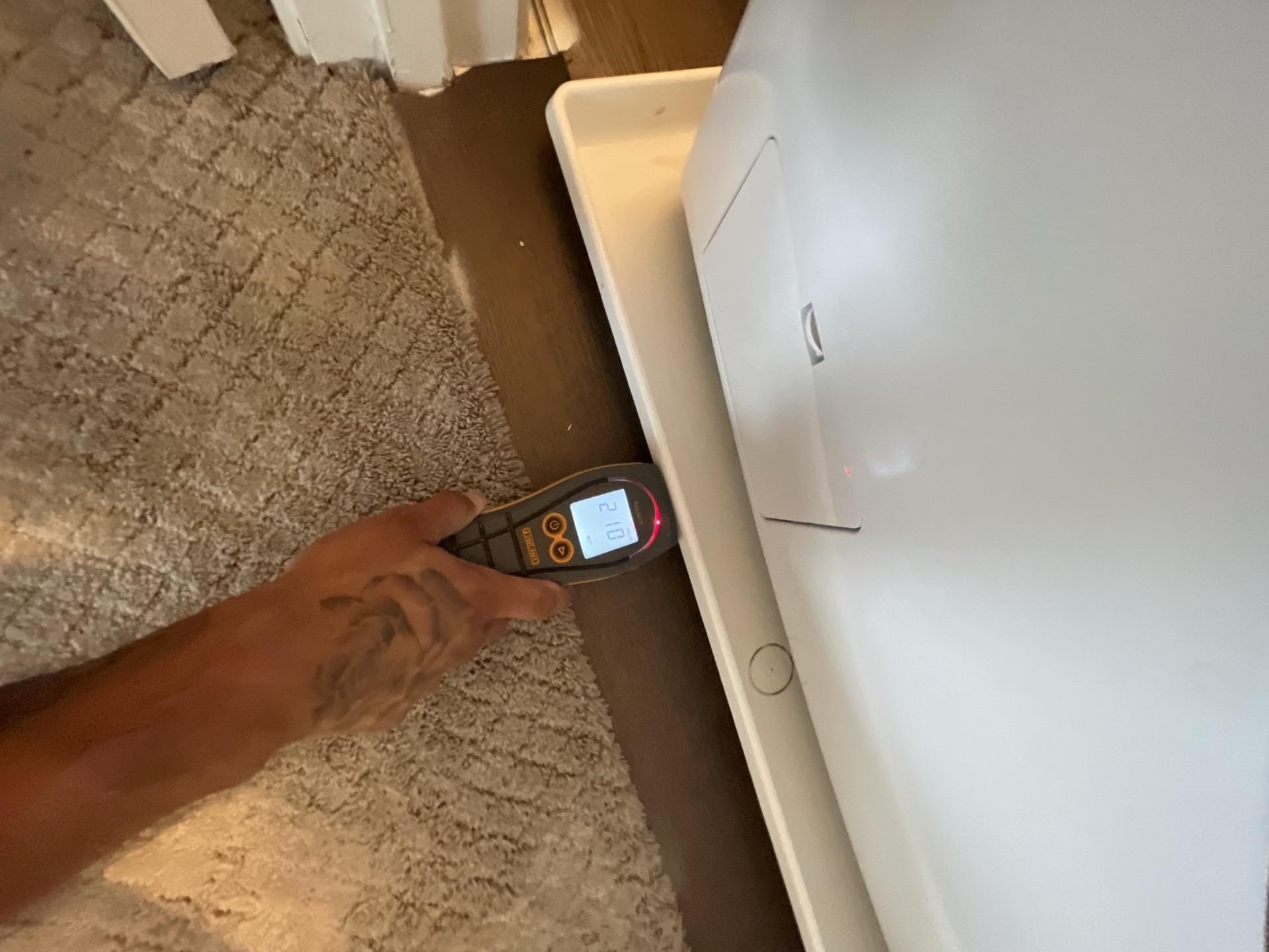 Second moisture reading confirming water migration from the laundry room