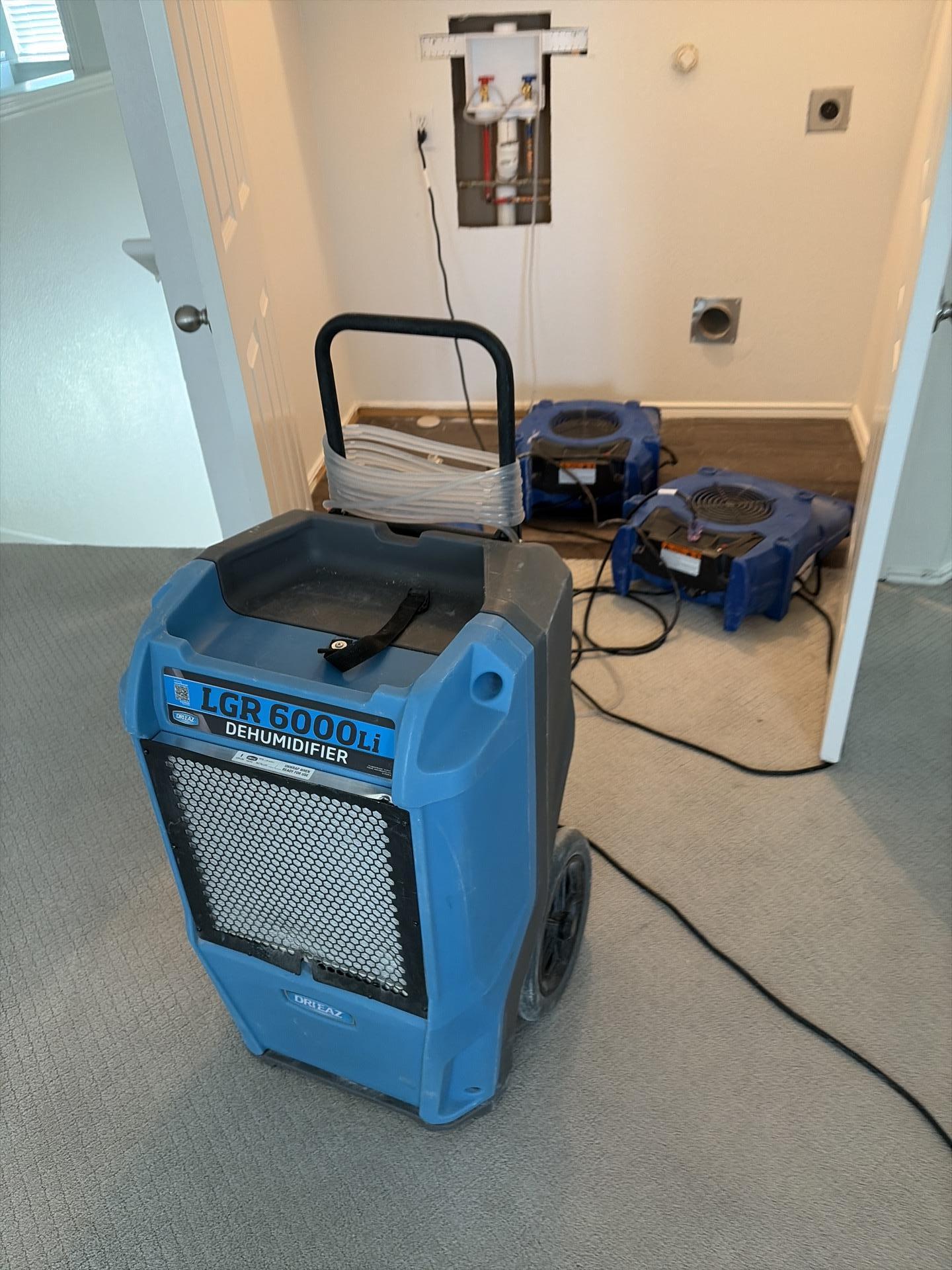 Upstairs family room drying process with air movers in place
