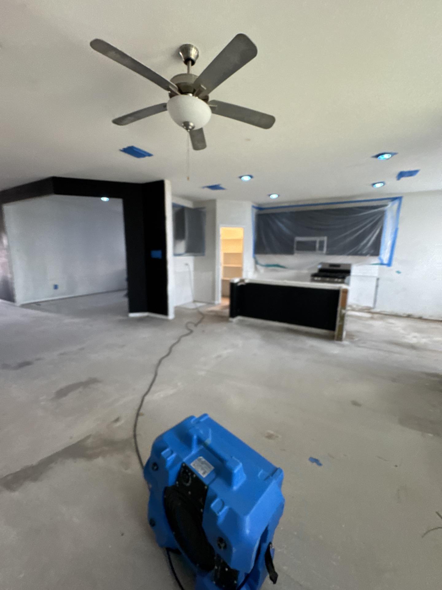 Kitchen and living room under containment with air scrubbing equipment