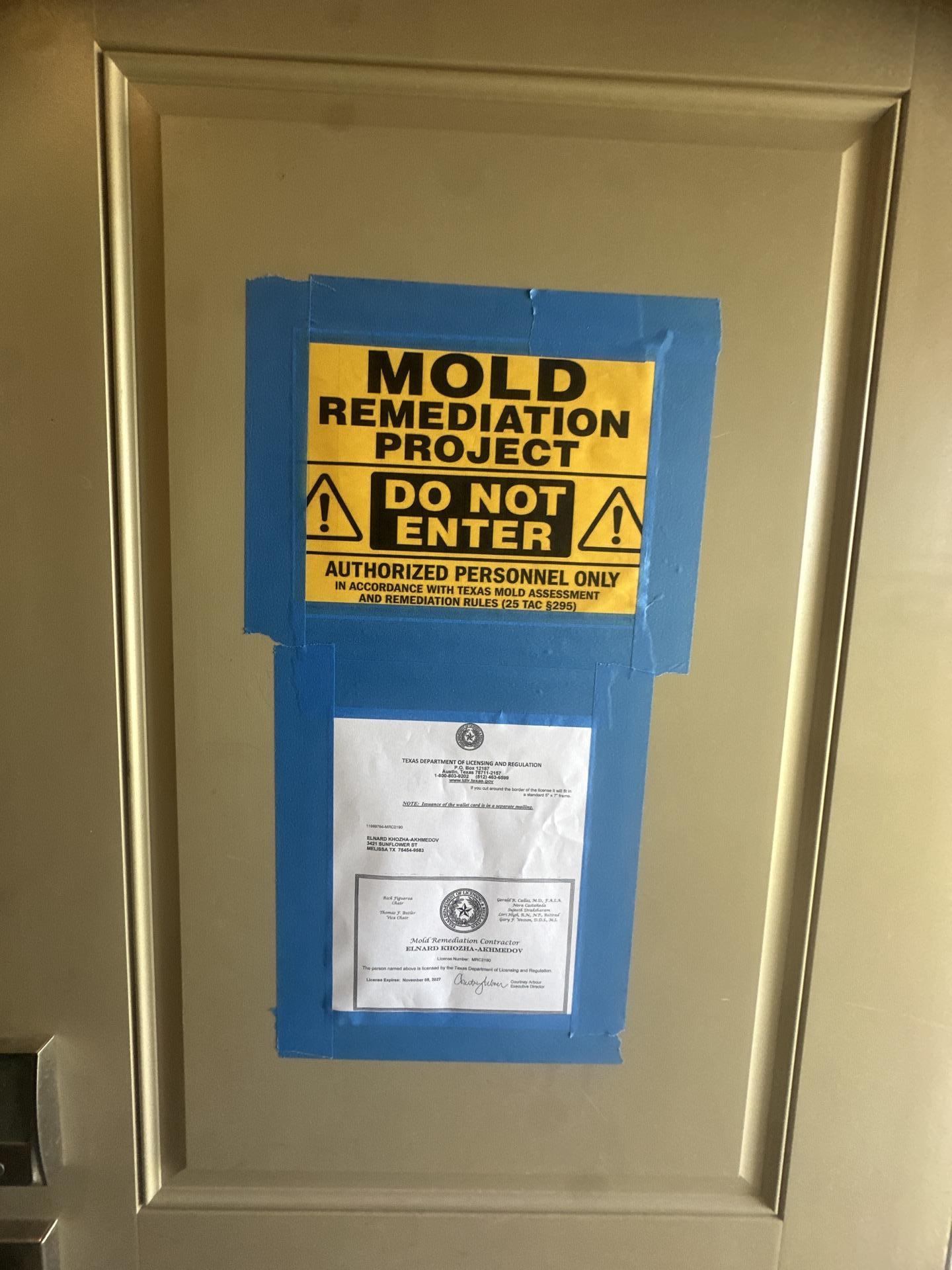 Plastic containment barriers sealing off rooms across the whole house