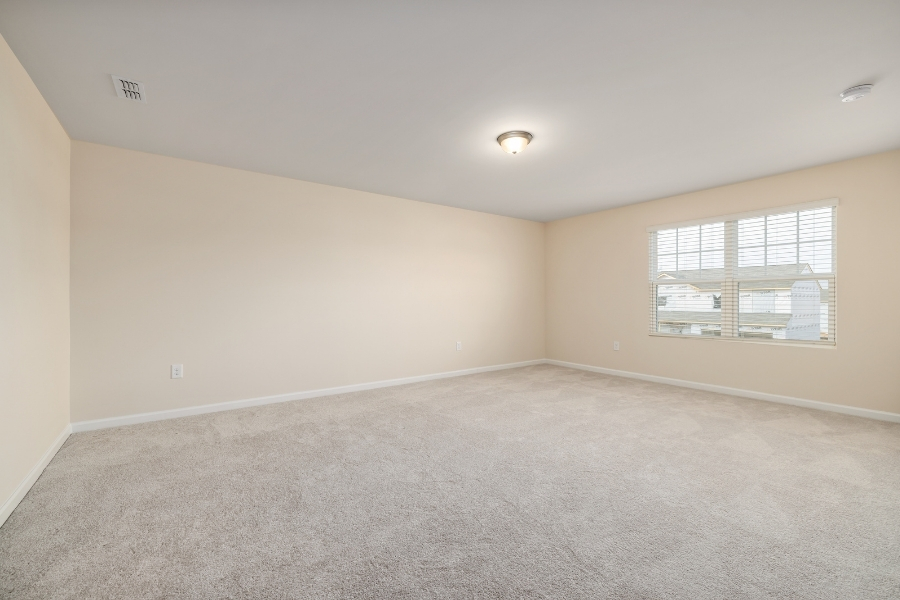 Fully restored room with clean new carpet after professional fire damage restoration in Plano, TX